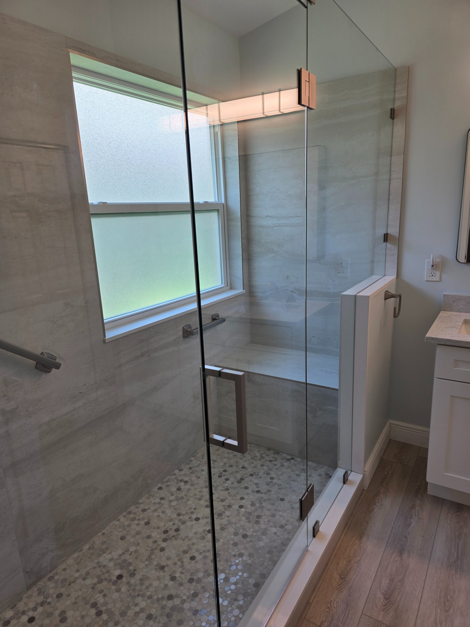 Frameless glass shower enclosure — Ann's master bath — Boynton Beach