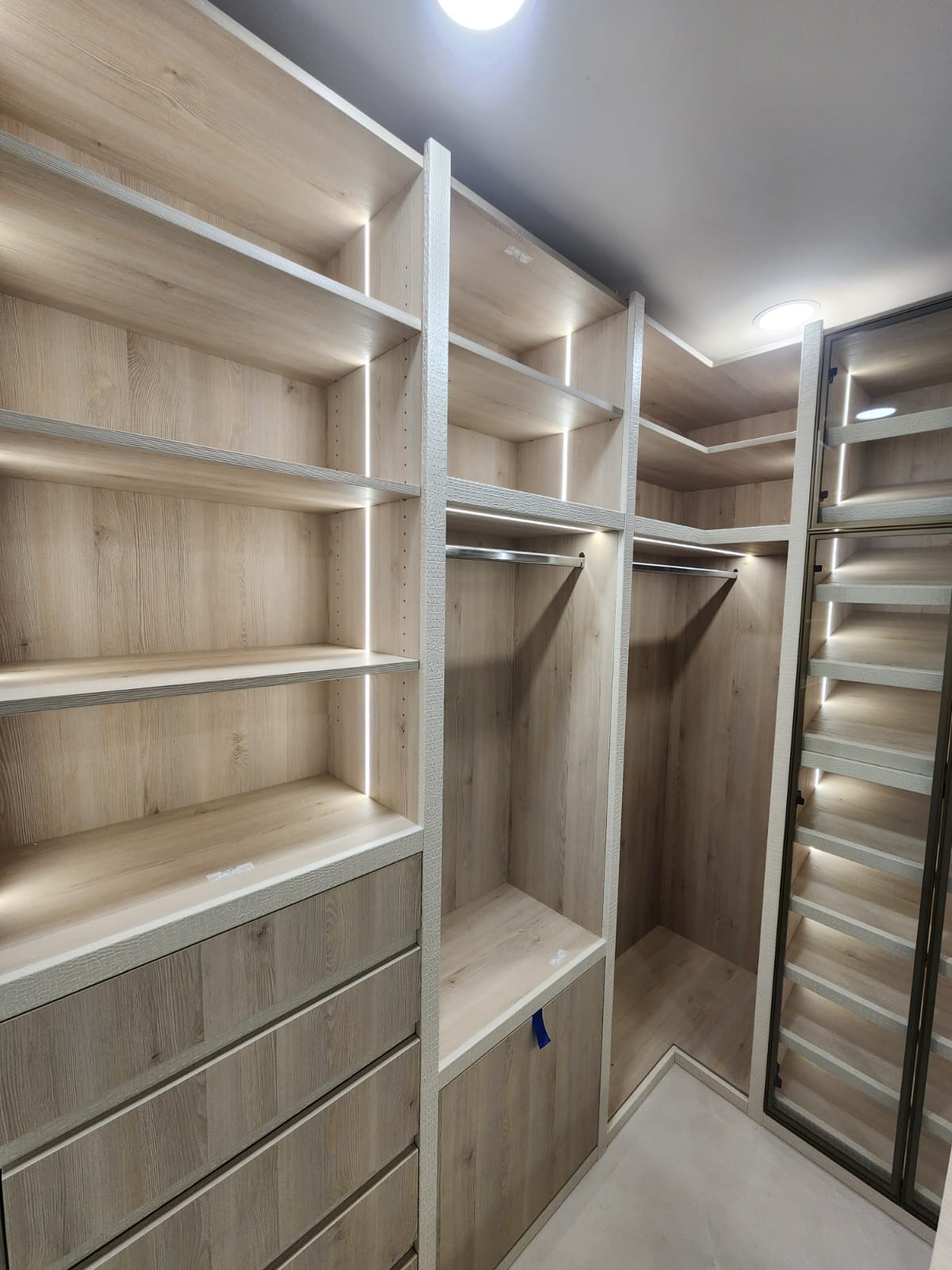 Kristen walk-in closet — drawer bank and shoe storage