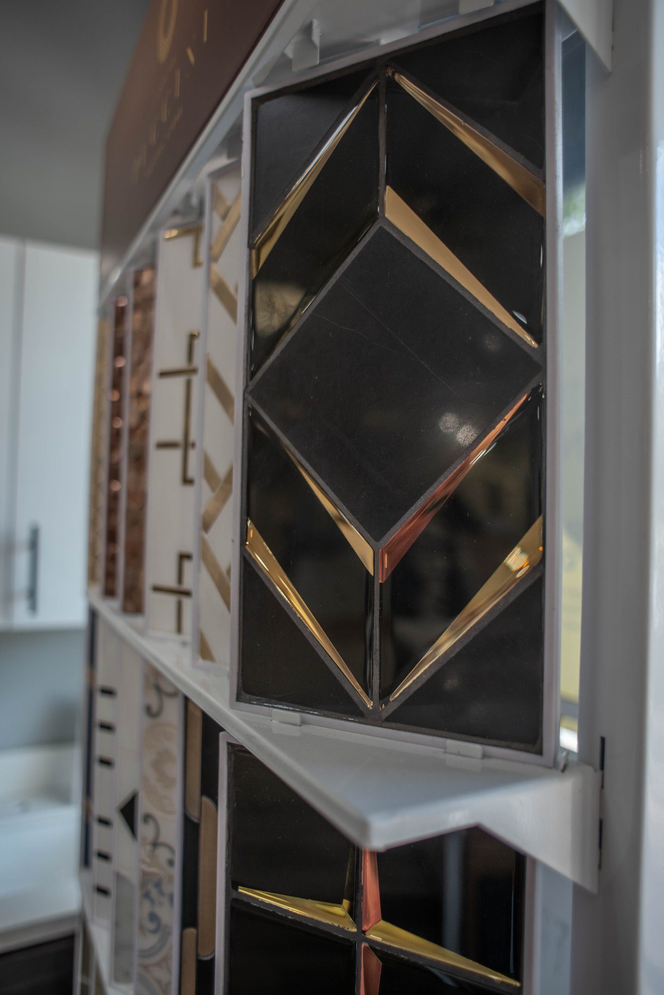 Flooring samples including LVP, porcelain tile and hardwood — Best Price Kitchen Bath & Floors showroom